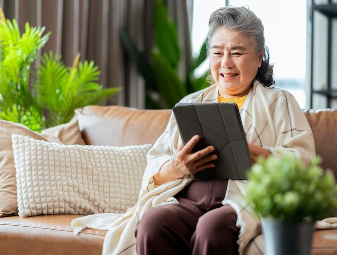 Old Senior Asian Grandmother Sit Casual Relax Hand Use Smartphone Technology Device Video 